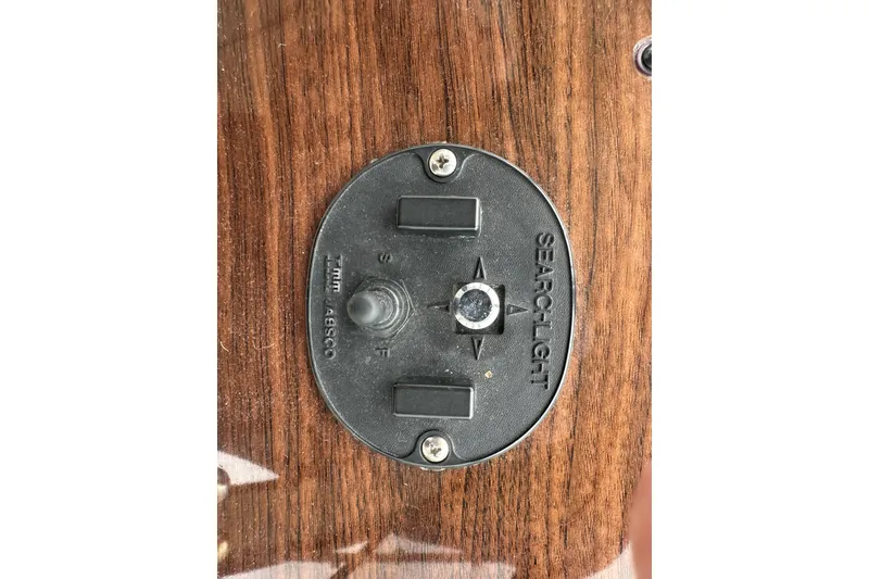 Slide: The Image of Searchlight control panel on 2005 Chaparral Signature 350 boat dashboard. - 23
