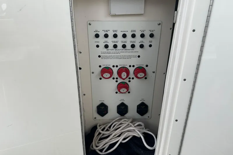 Slide: The Image of Control panel of a 2005 Chaparral Signature 350 boat with battery selectors and switches. - 27