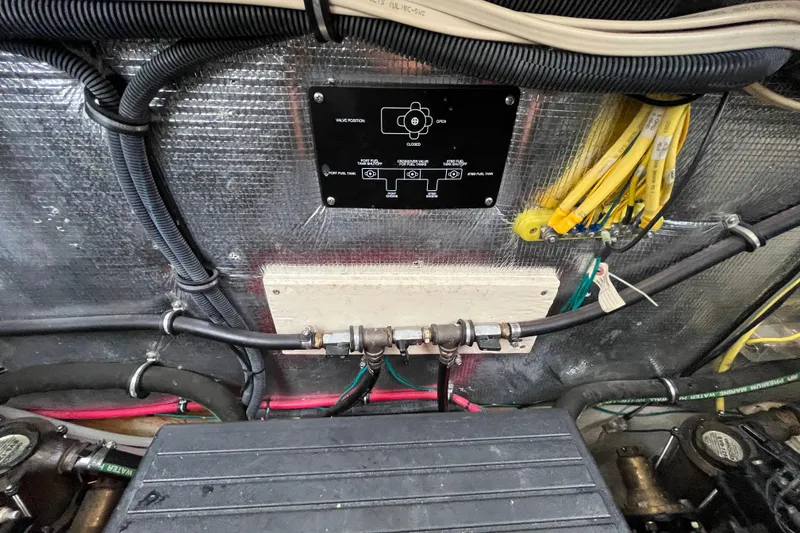 Slide: The Image of Engine compartment of a 2005 Chaparral Signature 350 boat, showing wiring and control panel. - 37
