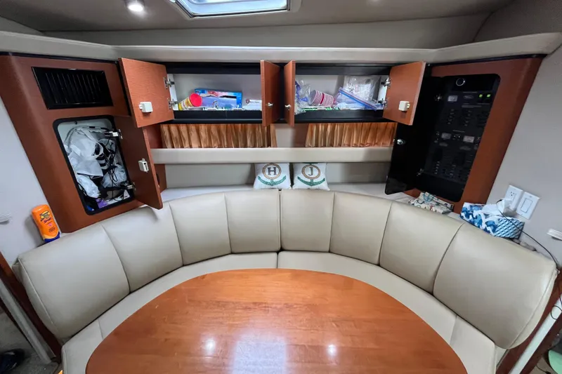Slide: The Image of Interior of 2005 Chaparral Signature 350 yacht with open cabinets and seating area. - 41
