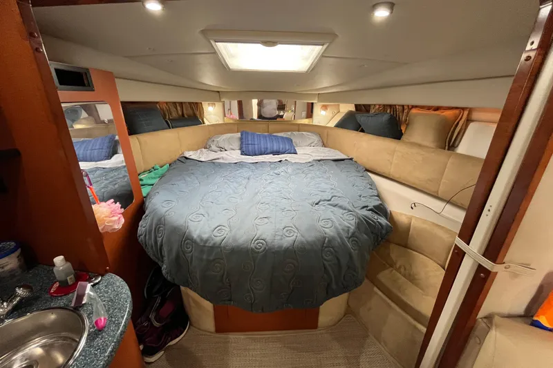 Slide: The Image of Luxurious cabin interior of 2005 Chaparral Signature 350 yacht with cozy bed and elegant decor. - 43