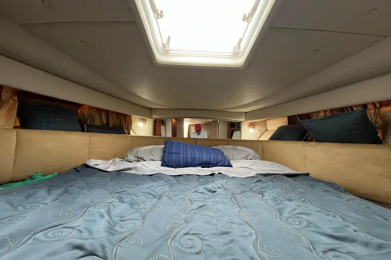 Slide: The Image of Interior cabin of 2005 Chaparral Signature 350 yacht with cozy bedding. - 44