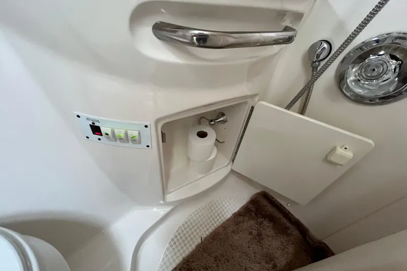 Slide: The Image of Bathroom interior of 2005 Chaparral Signature 350 yacht with storage and controls. - 49