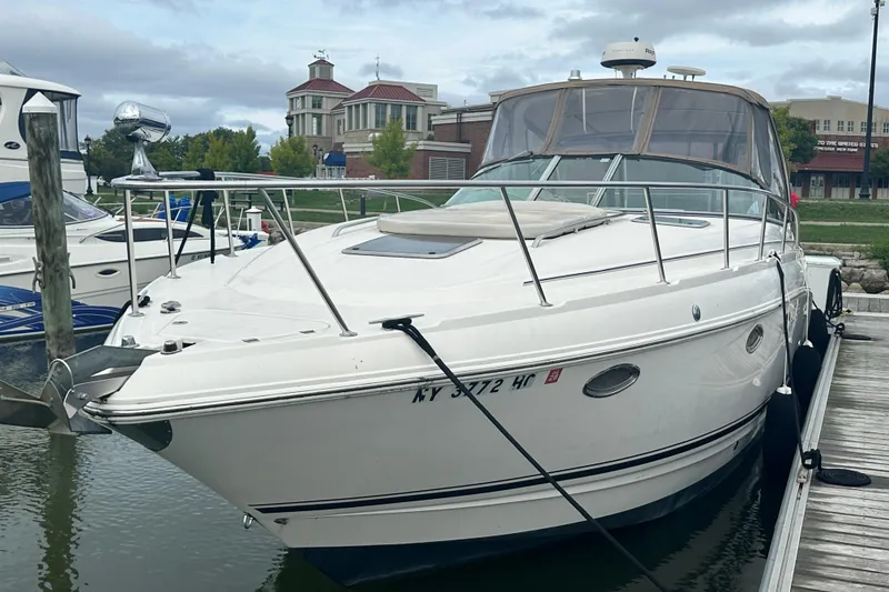 Slide: The Image of 2005 Chaparral Signature 350 boat docked at marina, overcast sky in background. - 5