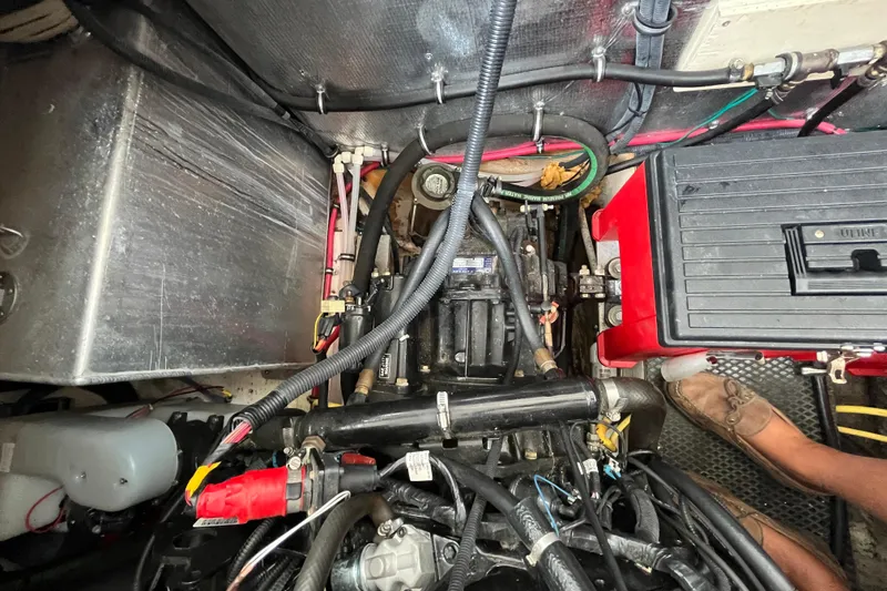 Slide: The Image of Engine compartment of a 2005 Chaparral Signature 350 boat, showing wiring and components. - 55