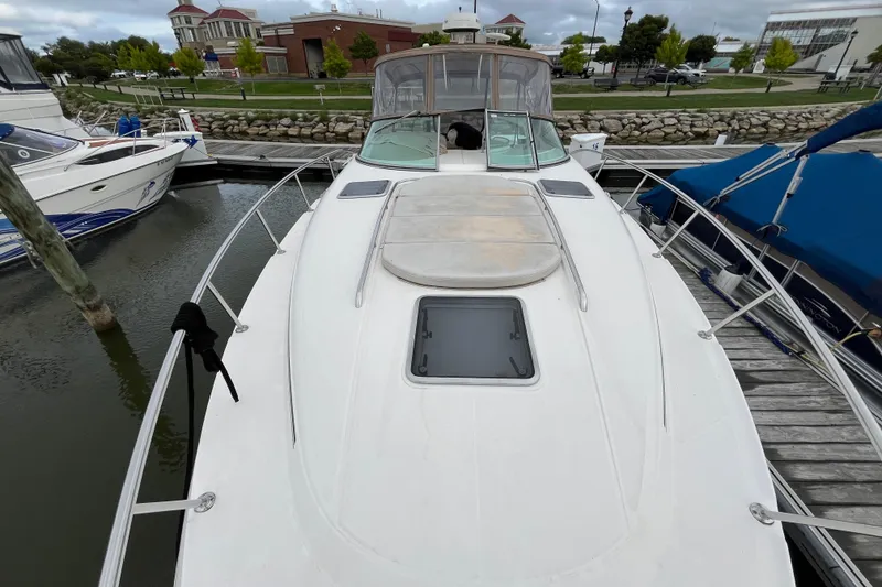 Slide: The Image of 2005 Chaparral Signature 350 yacht docked at marina, showcasing sleek design and spacious deck. - 6