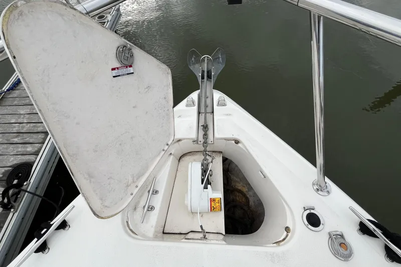 Slide: The Image of Bow anchor compartment of 2005 Chaparral Signature 350 boat at dock. - 9