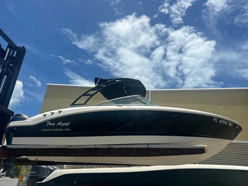 Slide: The Image of 2021 Chaparral 21 SSi boat against blue sky. - 17