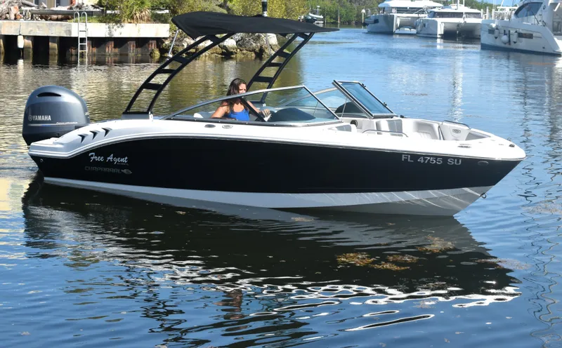 Slide: The Image of 2021 Chaparral 21 SSi boat on calm water. - 4