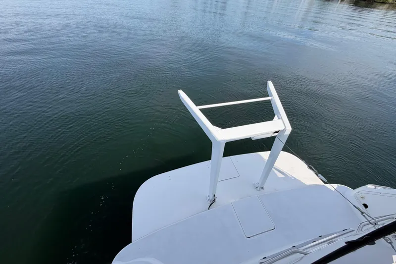 Slide: The Image of 1997 Sea Ray 370 Aft Cabin boat deck overlooking calm water. - 14