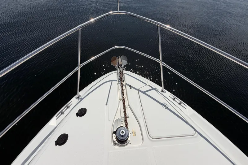 Slide: The Image of Bow view of 1997 Sea Ray 370 Aft Cabin yacht on calm water. - 15