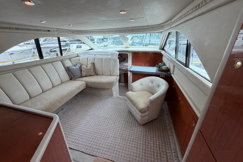 Slide: The Image of Luxurious interior of a 1997 Sea Ray 370 Aft Cabin yacht with plush seating. - 16