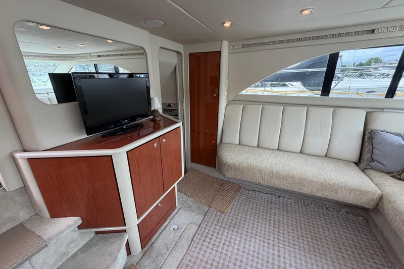 Slide: The Image of Luxurious interior of 1997 Sea Ray 370 Aft Cabin yacht with TV and seating area. - 17