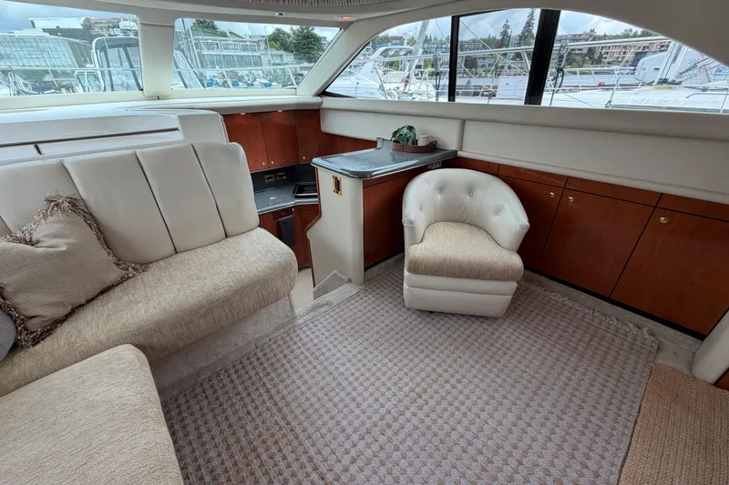 Slide: The Image of Luxurious interior of 1997 Sea Ray 370 Aft Cabin yacht with plush seating and elegant decor. - 18