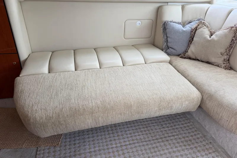 Slide: The Image of Interior seating of 1997 Sea Ray 370 Aft Cabin with beige upholstery and cushions. - 20