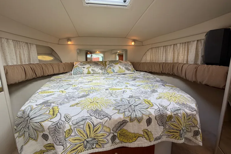 Slide: The Image of Cozy cabin interior of 1997 Sea Ray 370 Aft Cabin with floral bedding. - 25