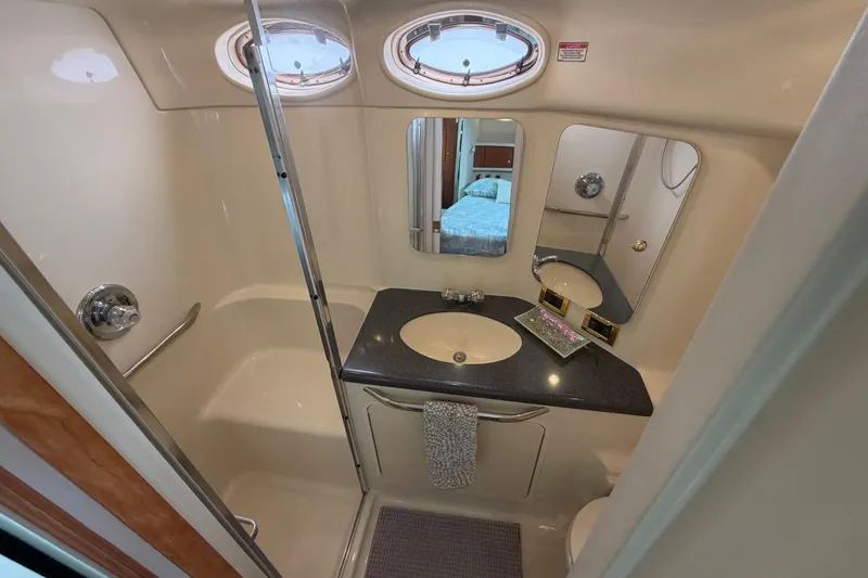 Slide: The Image of Bathroom interior of 1997 Sea Ray 370 Aft Cabin yacht with sink and shower. - 34
