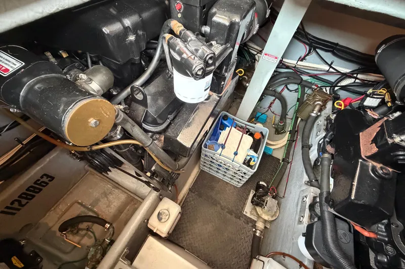 Slide: The Image of Engine room of a 1997 Sea Ray 370 Aft Cabin with visible components and wiring. - 36