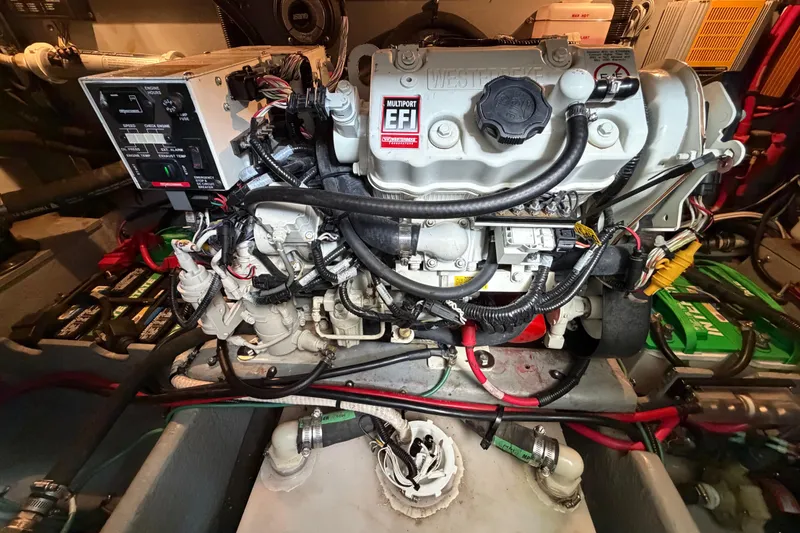 Slide: The Image of Engine room of a 1997 Sea Ray 370 Aft Cabin with visible wiring and components. - 37