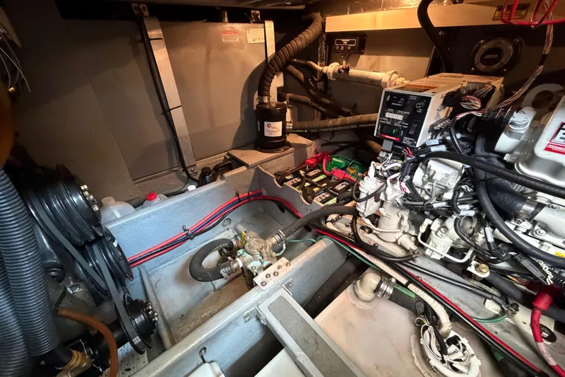 Slide: The Image of Engine room of a 1997 Sea Ray 370 Aft Cabin with visible wiring and components. - 39