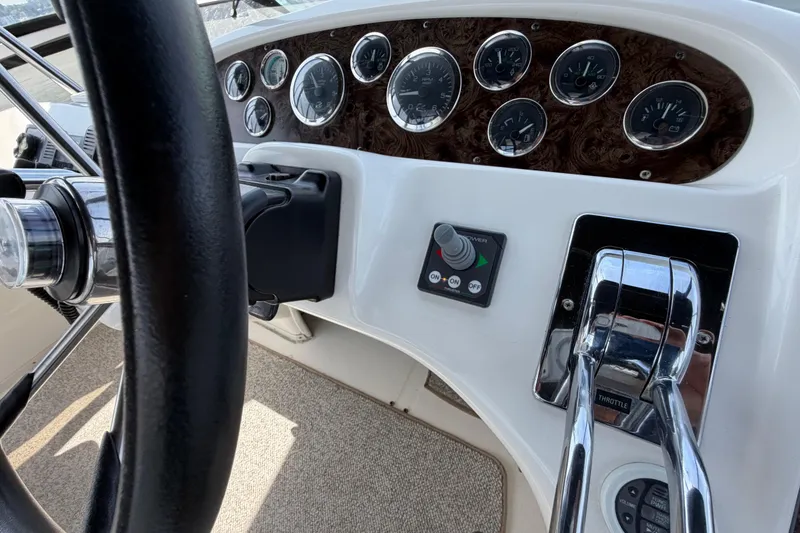 Slide: The Image of Steering wheel and dashboard of 1997 Sea Ray 370 Aft Cabin boat. - 8