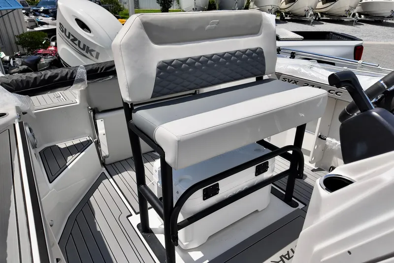 Slide: The Image of 2026 Starcraft SVX 211 OB CC boat interior with seating and Suzuki outboard motor. - 11