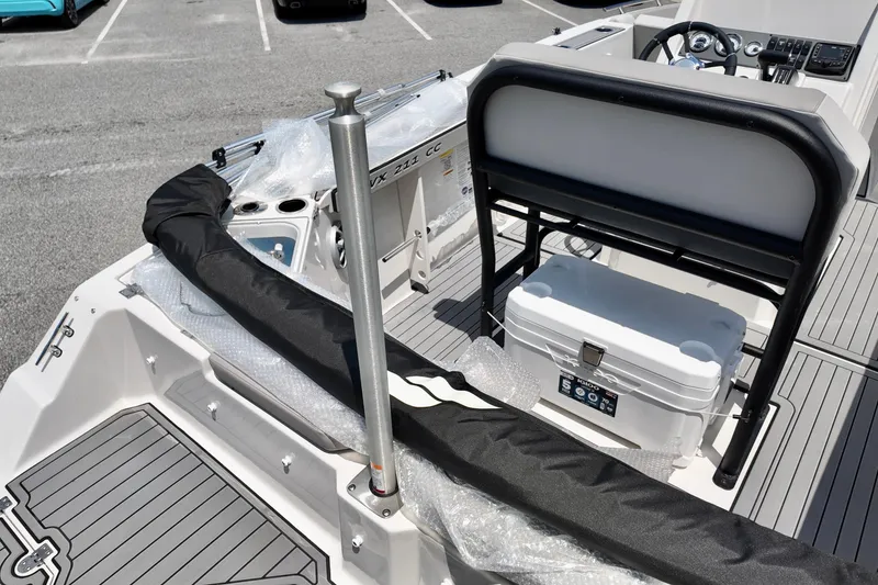 Slide: The Image of 2026 Starcraft SVX 211 OB CC boat interior with seating and storage features. - 13
