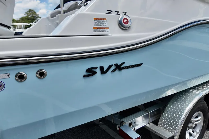 Slide: The Image of 2026 Starcraft SVX 211 OB CC boat on trailer, close-up view. - 4