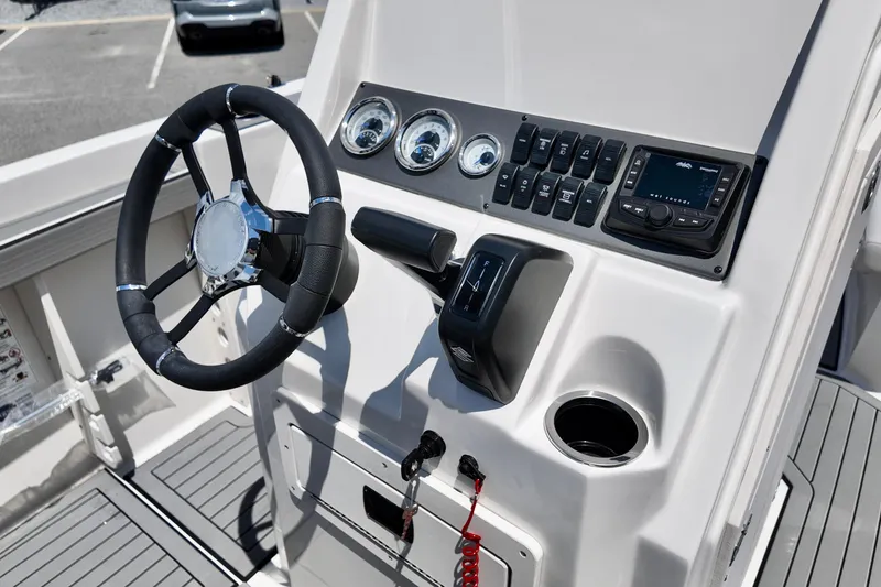 Slide: The Image of Steering console of 2026 Starcraft SVX 211 OB CC boat with gauges and controls. - 5