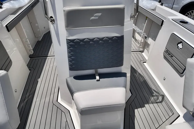 Slide: The Image of 2026 Starcraft SVX 211 OB CC boat interior with gray seating and sleek flooring design. - 7