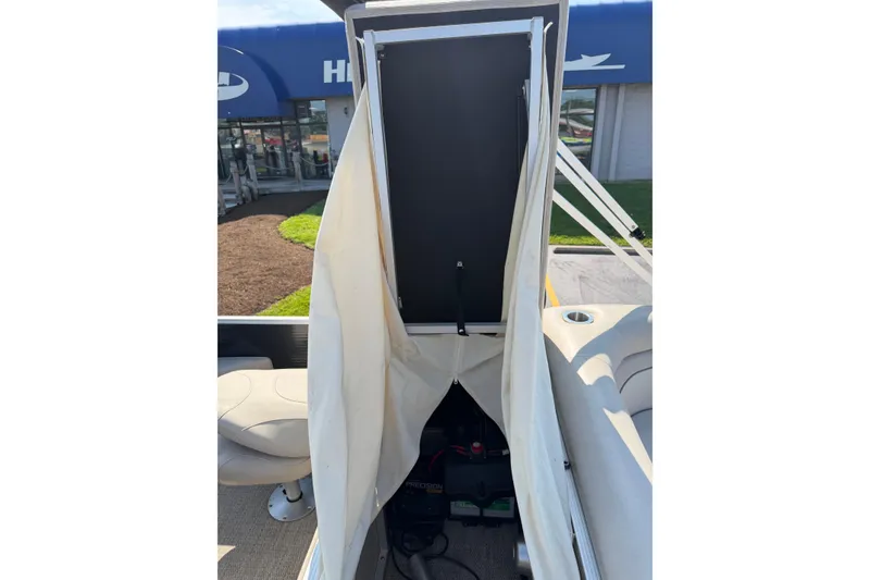 Slide: The Image of 2018 Bennington 21 SF boat interior with open storage compartment. - 10