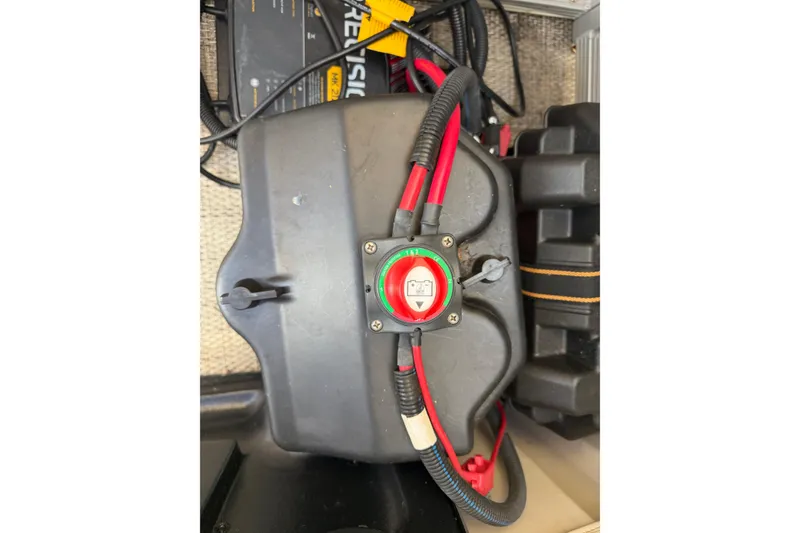 Slide: The Image of Battery compartment of a 2018 Bennington 21 SF boat with wiring connections. - 11