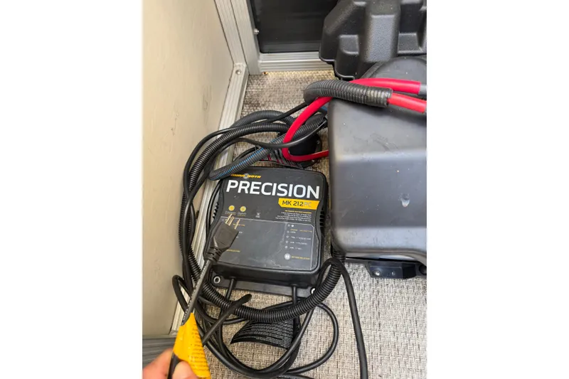 Slide: The Image of Battery charger and cables on a 2018 Bennington 21 SF boat. - 12