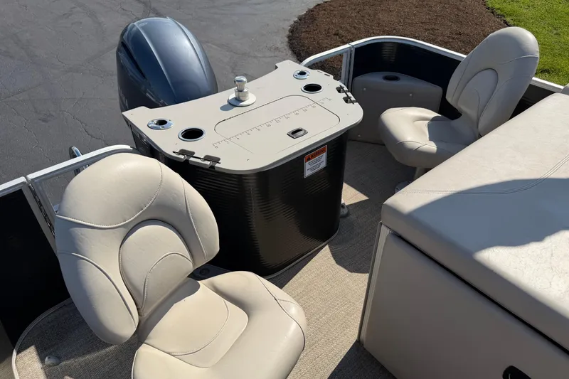 Slide: The Image of 2018 Bennington 21 SF boat interior with seating and control panel. - 13