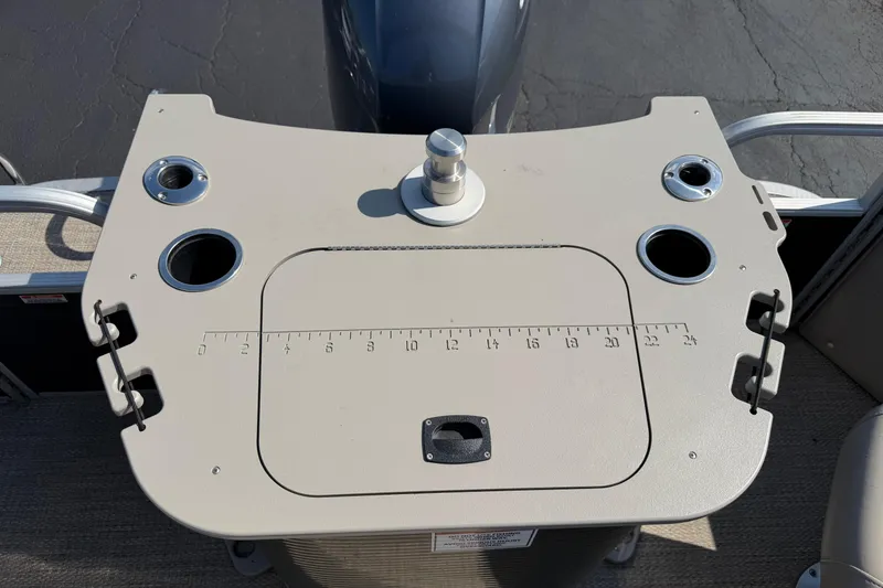 Slide: The Image of 2018 Bennington 21 SF boat console with cup holders and measurement markings. - 14