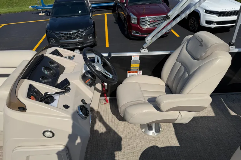 Slide: The Image of 2018 Bennington 21 SF boat interior with steering wheel and captain's chair. - 4