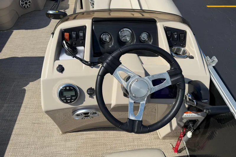 Slide: The Image of Steering console of a 2018 Bennington 21 SF boat with gauges and controls. - 5
