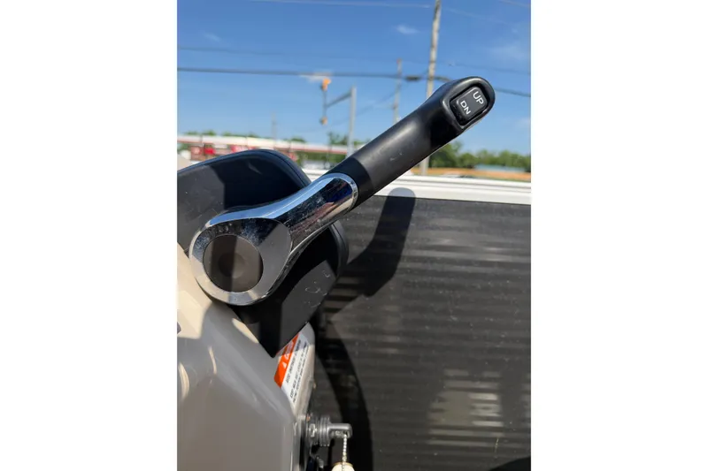 Slide: The Image of Close-up of a 2018 Bennington 21 SF boat throttle lever under clear blue sky. - 8