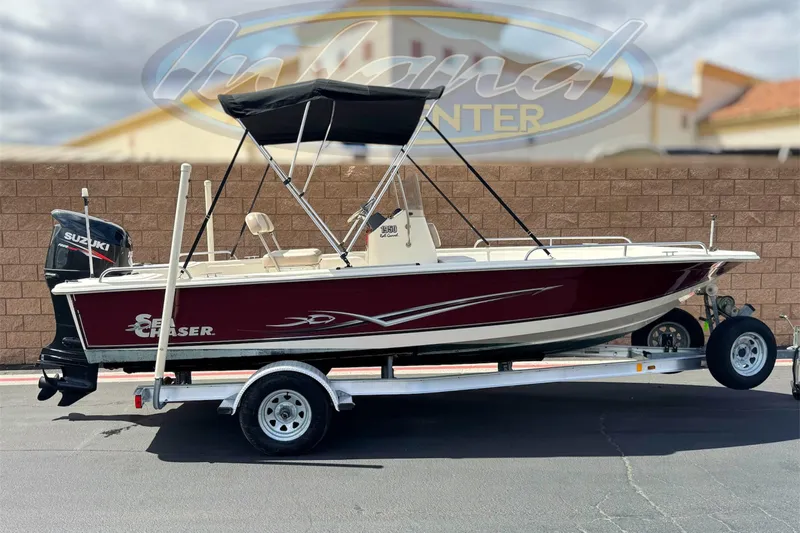 The Image of 2013 Carolina Skiff Sea Chaser 1950 RG boat on trailer with Suzuki outboard motor. - 0