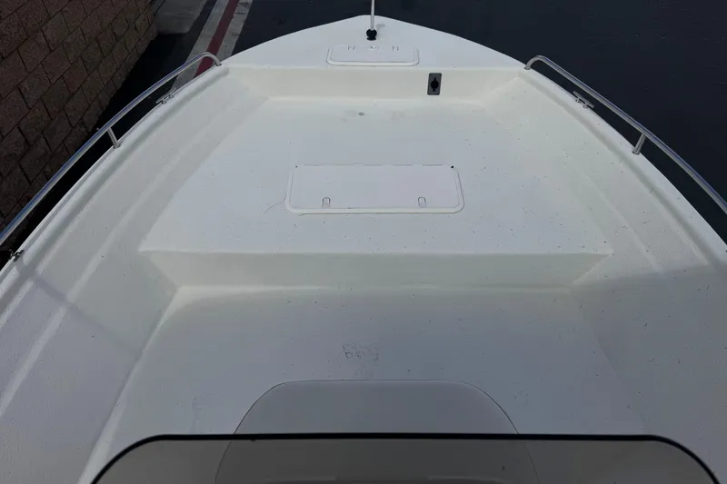 Slide: The Image of Bow view of 2013 Carolina Skiff Sea Chaser 1950 RG, featuring storage compartments. - 11