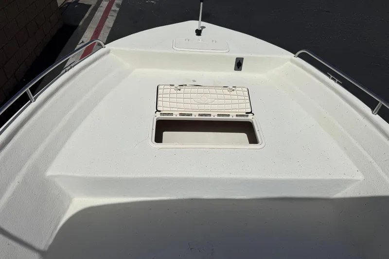 Slide: The Image of Bow of 2013 Carolina Skiff Sea Chaser 1950 RG with open storage compartment. - 12