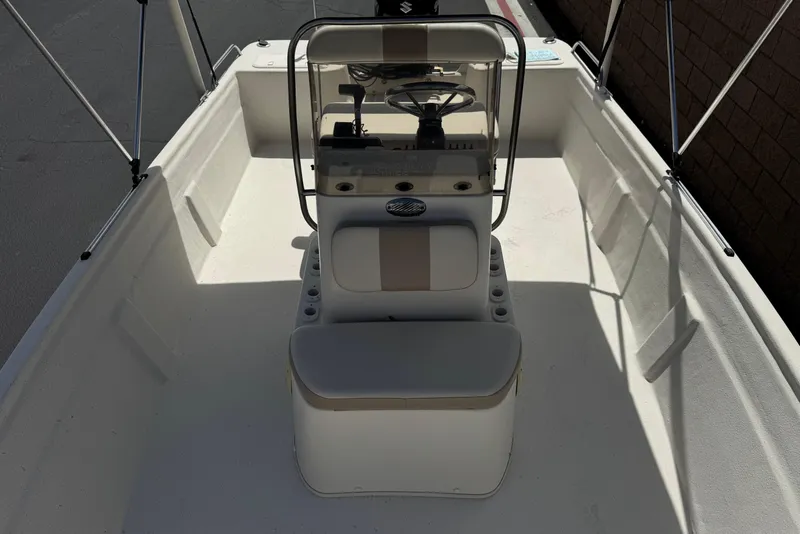 Slide: The Image of 2013 Carolina Skiff Sea Chaser 1950 RG boat interior with steering console and seating. - 13