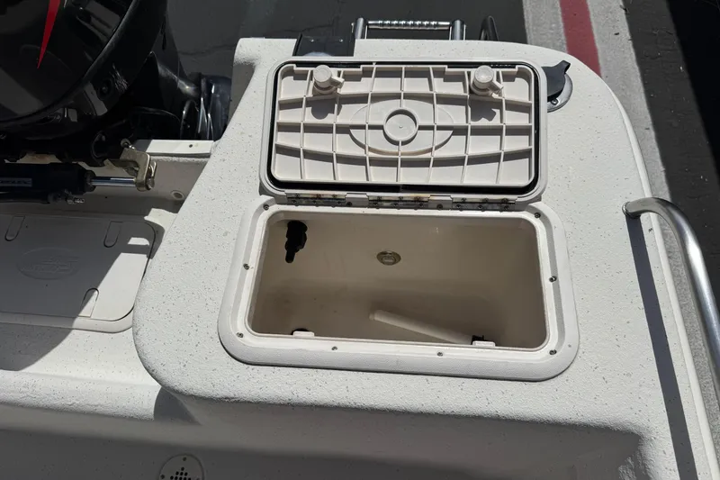 Slide: The Image of Open storage compartment on 2013 Carolina Skiff Sea Chaser 1950 RG boat. - 17
