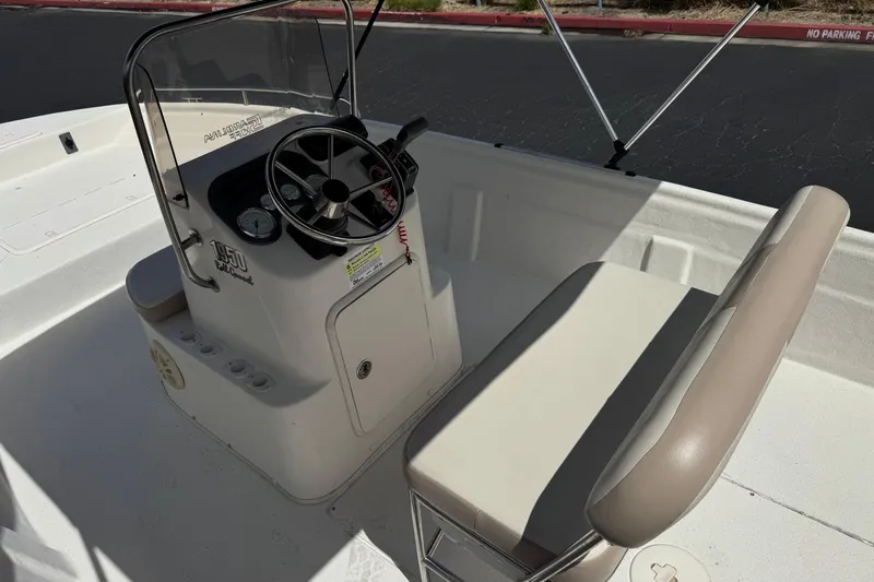 Slide: The Image of 2013 Carolina Skiff Sea Chaser 1950 RG boat interior with steering console and seating. - 19