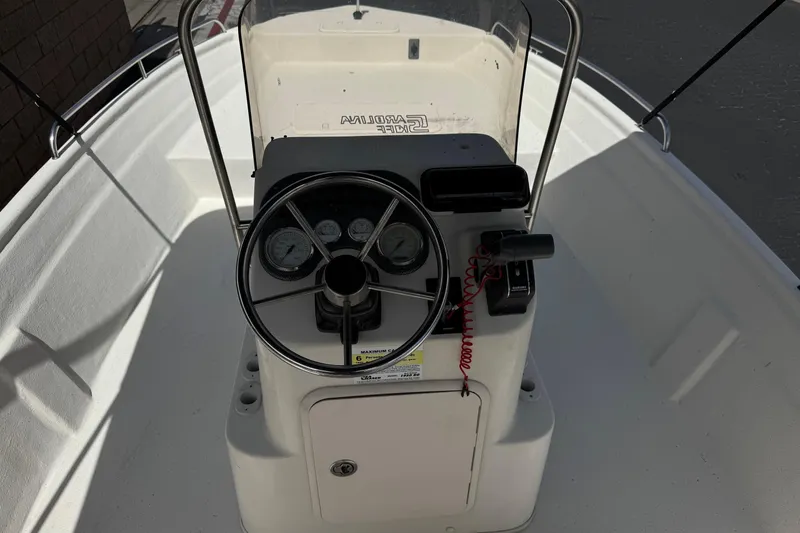 Slide: The Image of 2013 Carolina Skiff Sea Chaser 1950 RG boat console with steering wheel and gauges. - 20