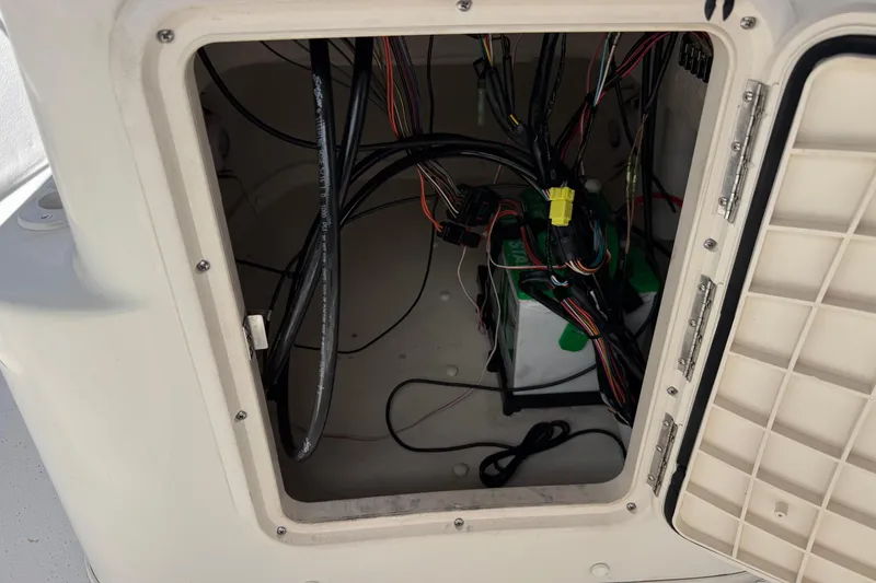 Slide: The Image of Open compartment with wiring inside a 2013 Carolina Skiff Sea Chaser 1950 RG boat. - 22