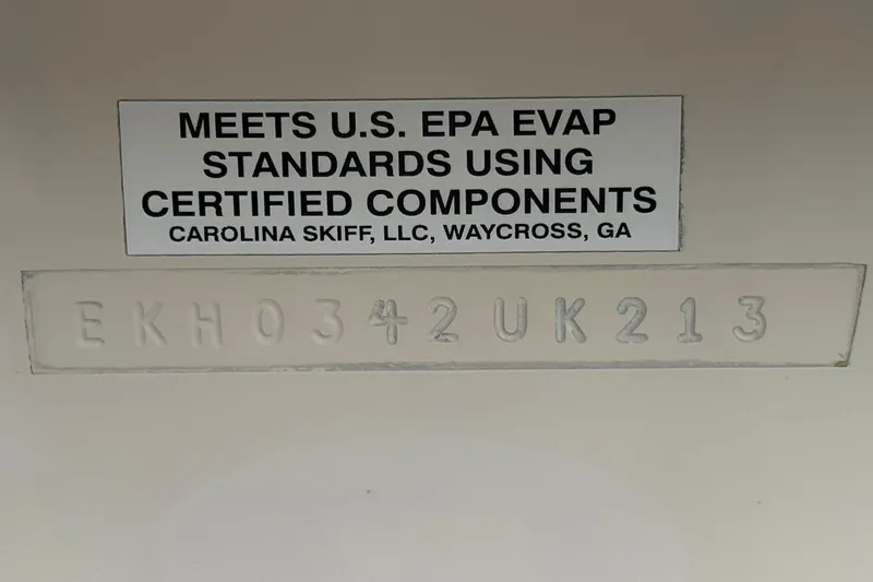 Slide: The Image of 2013 Carolina Skiff Sea Chaser 1950 RG compliance label with serial number. - 26