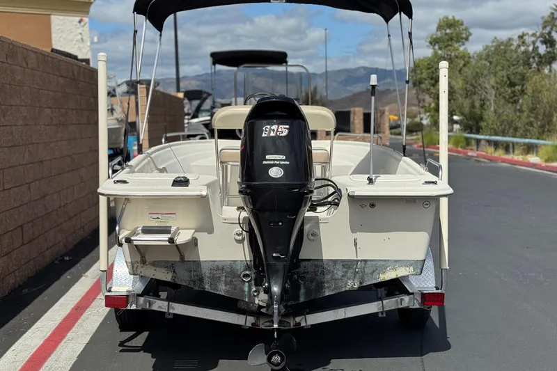 Slide: The Image of 2013 Carolina Skiff Sea Chaser 1950 RG boat with outboard motor on trailer. - 4