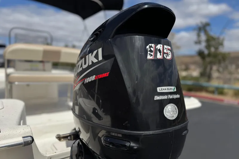 Slide: The Image of Suzuki 115 four-stroke outboard motor on 2013 Carolina Skiff Sea Chaser 1950 RG boat. - 7