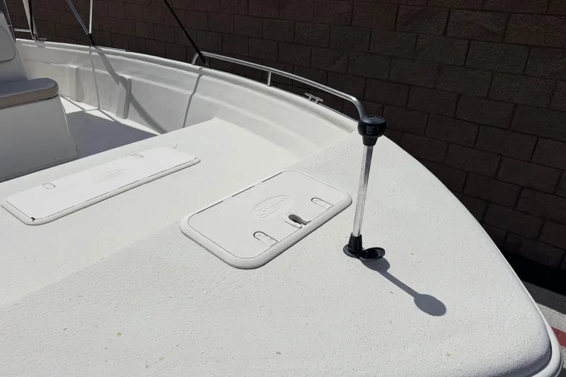 Slide: The Image of 2013 Carolina Skiff Sea Chaser 1950 RG boat deck with storage compartments. - 9